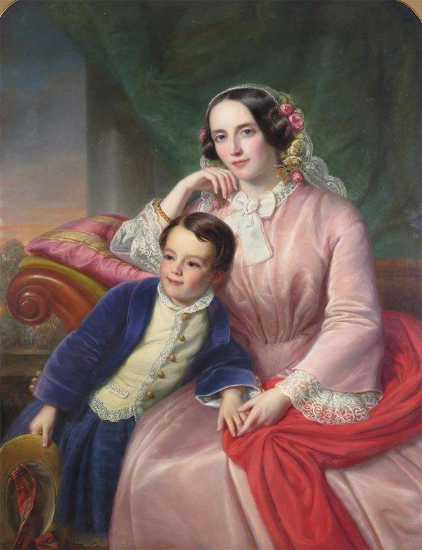 Portrait of a mother and son seated in an interior